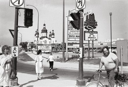 <b>John Paskievich</b>. <i>Main Street and Redwood Avenue</i>, from the series The North End Winnipeg. 1985. Collection of the Winnipeg Art Gallery, courtesy of University of Manitoba Press.