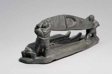 <b>Jimmy Inaruli Arnamissak</b>. <i>Two Men Loading Kayak onto Qamutiik (sled)</i>, c. 1980. Stone, 19.5 x 51 x 13.5 cm. Collection of the Winnipeg Art Gallery. Gift from the Collection of George and Tannis Richardson, 2011-61. Photograph: Ernest Mayer, courtesy of the Winnipeg Art Gallery.