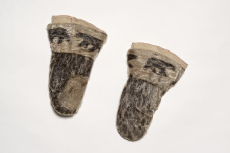 Unidentified artist. Mittens, c. 1960. sealskin, duffle, embroidery floss. Collection of the Winnipeg Art Gallery, Gift of the Canadian Museum of Inuit Art, 2017-607.1 to 4.