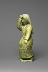 Oviloo Tunnillie (Canadian (Cape Dorset), 1949–2014). Grieving Woman, 1997, stone (green serpentinite)
35 x 12.5 x 11.3 cm. Collection of the Winnipeg Art Gallery. Gift of the Volunteer Committee to the Winnipeg Art Gallery in commemoration of the Volunteer Committee’s 50th Anniversary, 1948-1998, 1999-499. Photograph: Ernest Mayer, courtesy of the Winnipeg Art Gallery.