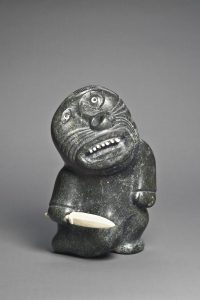 Abraham Kingmiaqtuq. Shaman Holding Knife, 1974. stone, antler, 35.5 x 22.2 x 25.2 cm. Collection of the Winnipeg Art Gallery; Gift of Dr. Harry Winrob, 2006-416.1 and 2.