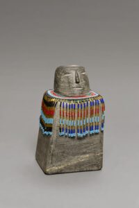 Eva Talooki Aliktiluk. Woman Wearing Beaded Amautik, 1993. stone, beads on string, fabric. Collection of the Winnipeg Art Gallery. Gift of George Swinton and his daughters, G-98-380. Photograph by: Ernest Mayer.