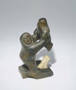 Josephie Eetook. Father Holding Child above Walrus in Celebration of the Hunt, c. 1960–1969. stone, ivory, 20 x 11.4 x 8.3 cm. Collection of the Winnipeg Art Gallery
Twomey Collection, with appreciation to the Province of Manitoba and Government of Canada, 1726.71. Photograph by Ernest Mayer, courtesy of WAG-Qaumajuq. 