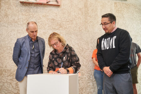 Nastania Mullin, MIA Chief Executive Officer, signing MOU. Photo: David Lipnowski