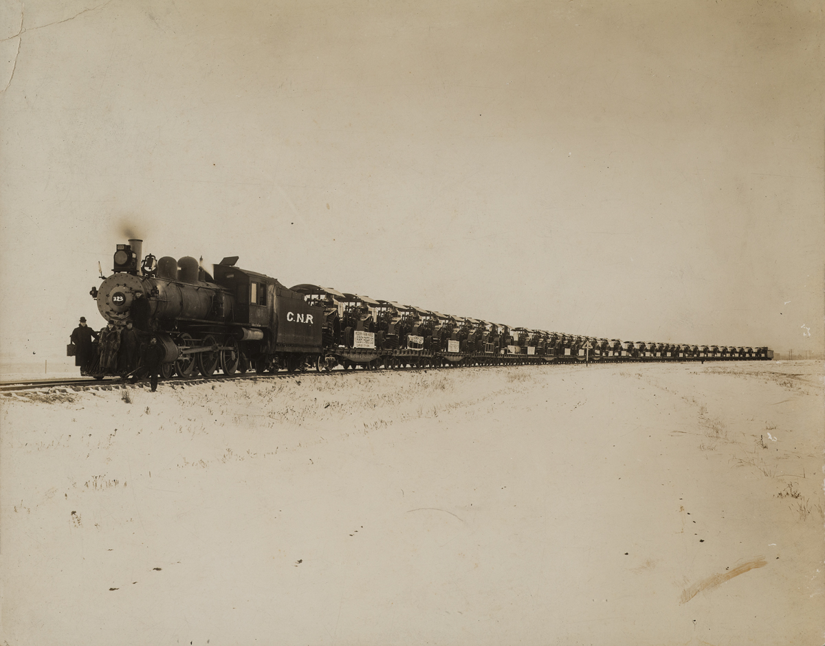 A Canadian Northern Railway Train Delivering Modern Farm Horse Tractors from the Hart-Parr Tractor Co. Iowa